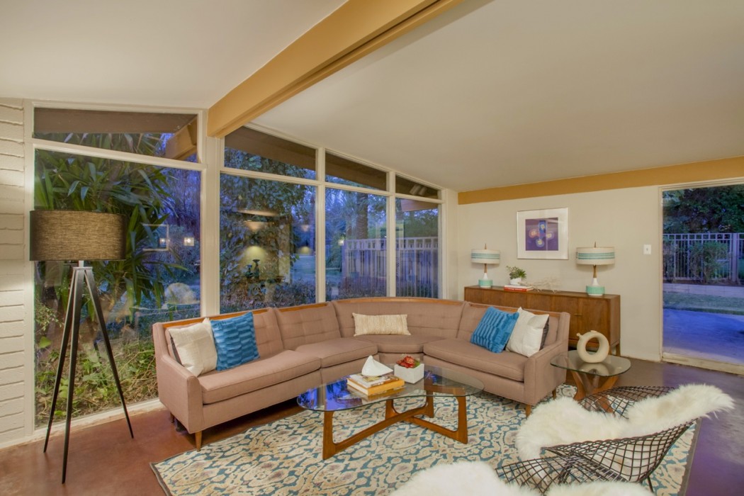 Vaulted ceilings and large, clerestory windows encompass the retro living room space of this 1955 Al Beadle-designed property in Phoenix, AZ. Photo by Hi-Res Media.